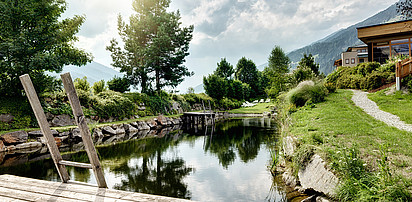 Sporthotel Sillian mit dem Naturbadeteich im Hochpustertal in Osttirol